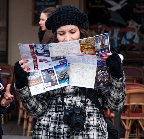 Lost tourist looking at map.
