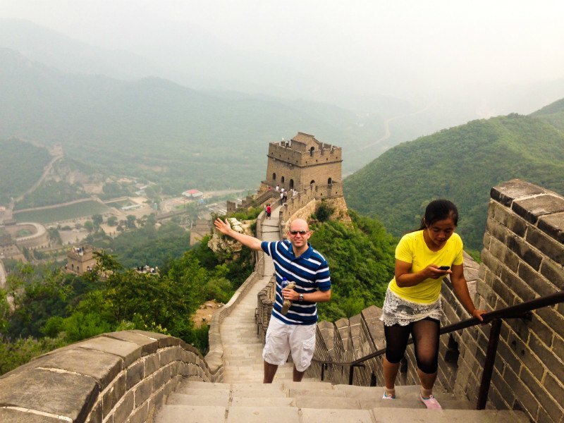 Phil walking on the Great Wall of China.