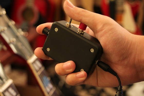 A hand flicking a switch.