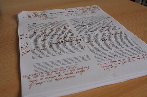 A page of text with proofreading marks.